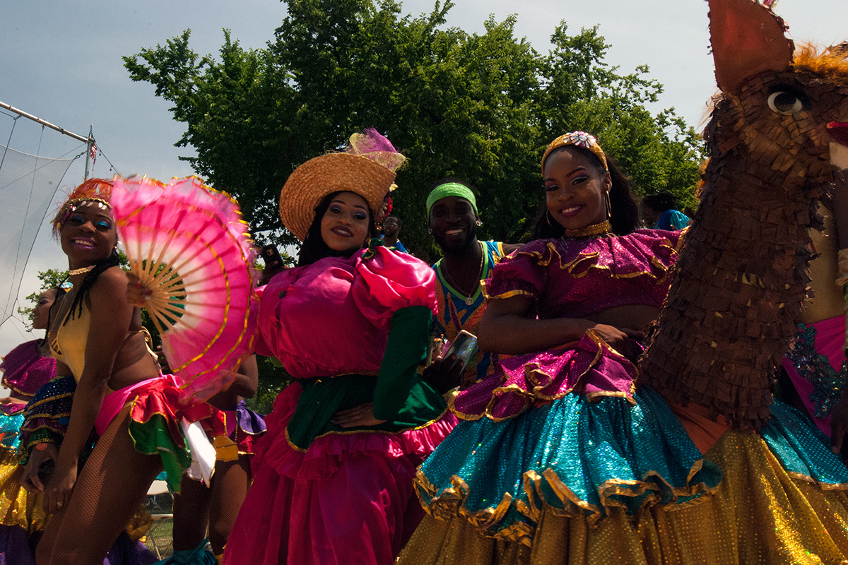 Dancers from UniverSoul Circus parade down the National Mall for the opening of the 2017 Folklife Festival. Photo by Ronald Villasante, Ralph Rinzler Folklife Archives