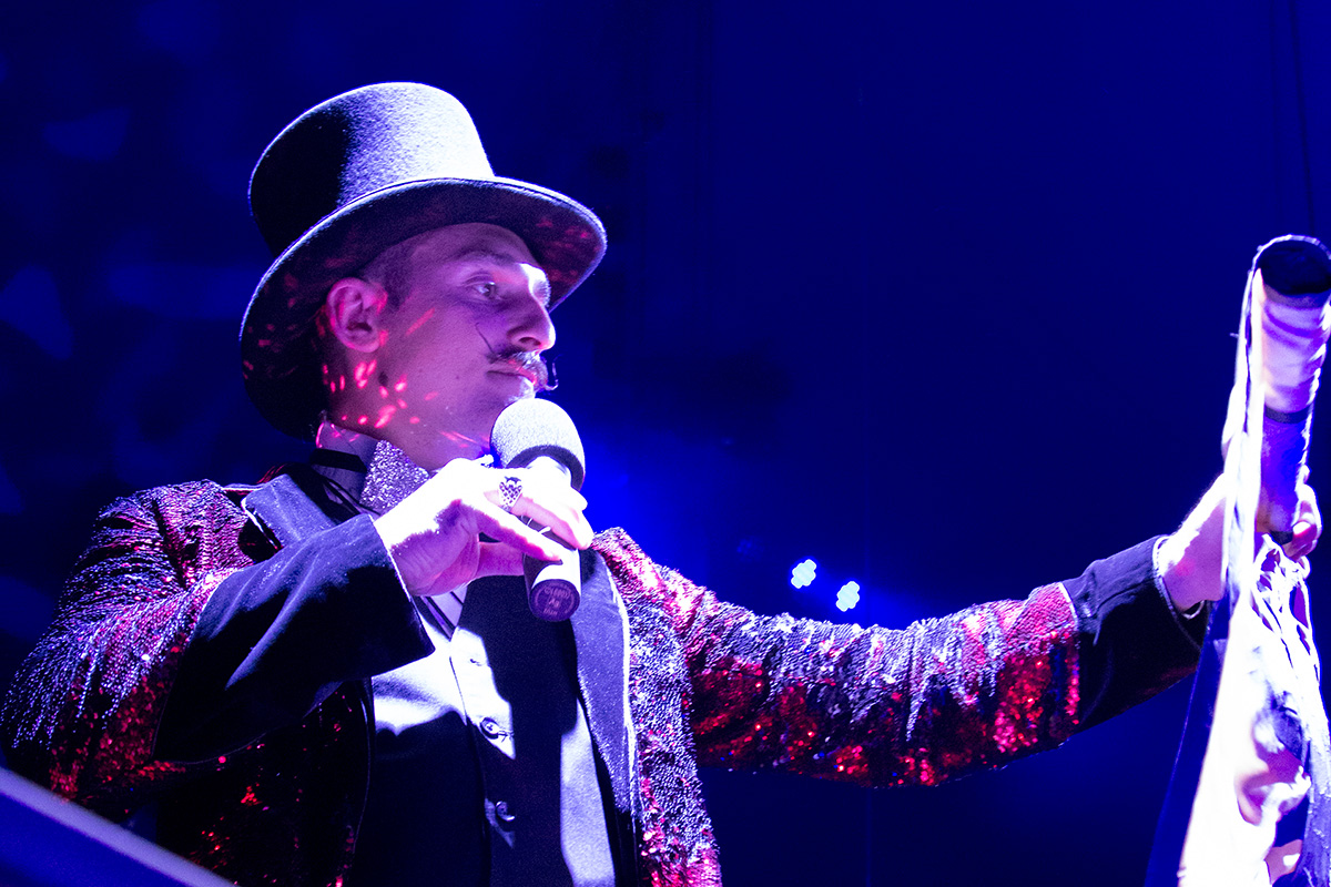 Ringmaster Timothy Mack reads aloud the Folklife Festival sponsors at the final Big Top performance. Photo by Josh Davis, Ralph Rinzler Folklife Archives