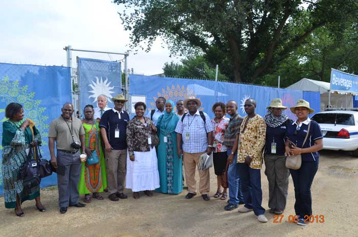 The delegation stands outside the Folklife Festival staff compound before touring the site and programs. Photo courtesy of the Kenya Cultural Centre