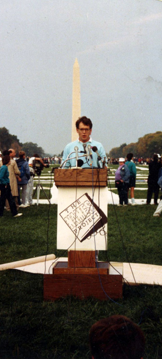 Cleve Jones, one of the founders of The AIDS Memorial Quilt, reads names at the 1987 Quilt display in Washington, D.C.