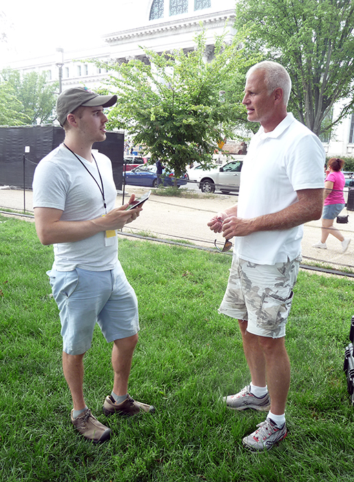 Volunteer Alex Lederer surveys a Festival visitor.