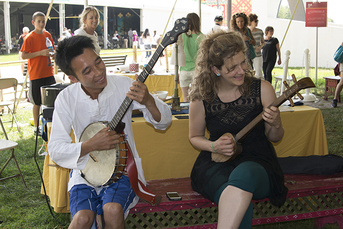 Abigail Washburn joins an impromptu jam in the China Textiles tent.