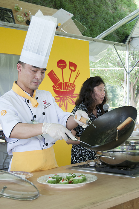 A foodways demonstration in China's Five Spice Kitchen.