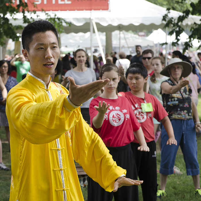 Chai Yunlong leads a tai chi demonstration in People's Park.