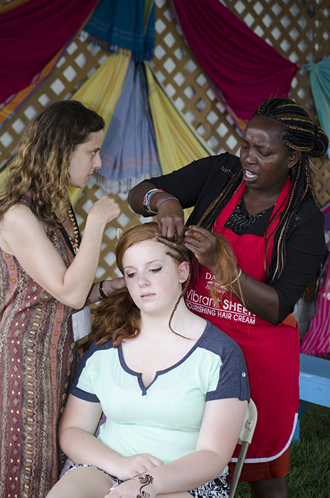 Hair braiding in Kenya's Adornment Arts tent.
