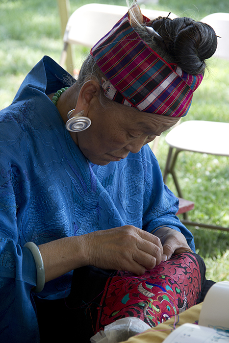 Pan Yuzhen demonstrates Miao embroidery.