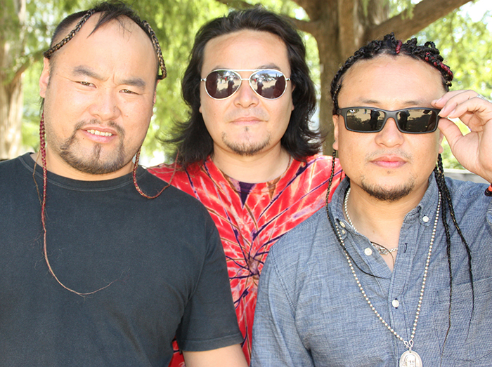 Some members of the Inner Mongolian band Ih Tsetsn visited the adornment tent to get their hair braided.