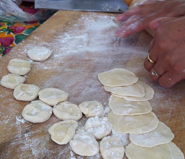 Tian Yali rolling out dumpling wrappers.