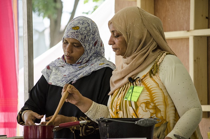 Amina Harith Swaleh and Fatma Ali Busaidy in the Flavors of Kenya kitchen. Photo by Kate Mankowski, Ralph Rinzler Folklife Archives and Collections, Smithsonian Institution