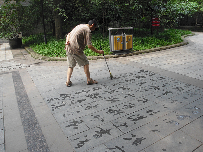 A water calligrapher practices in People’s Park, Chengdu, Sichuan Province.