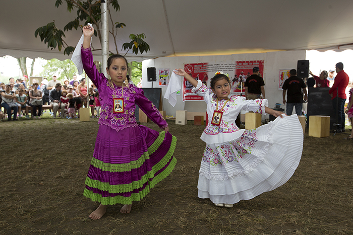 The young students of the Centro Cultural Perú in Virginia showed off the Marinera dance steps they have learned and invited visitors to the Wawawasi Kids Corners to try for themselves. Photo by Francisco Guerra, Ralph Rinzler Folklife Archives
