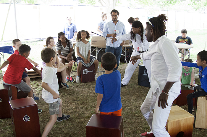 The Afro-Peruvian group Tutuma leads a cajón workshop for children at the Wawawasi Kids Corner. Photo by Rori Smith, Ralph Rinzler Folklife Archives