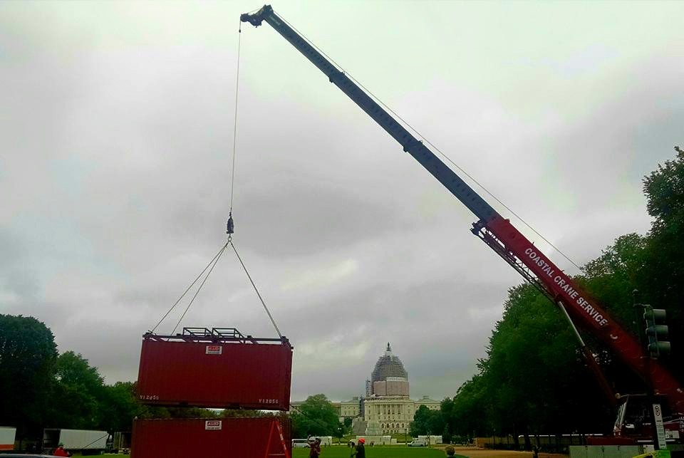 The Festival crew lifts the shipping containers by crane. Photo by Alex Saunders