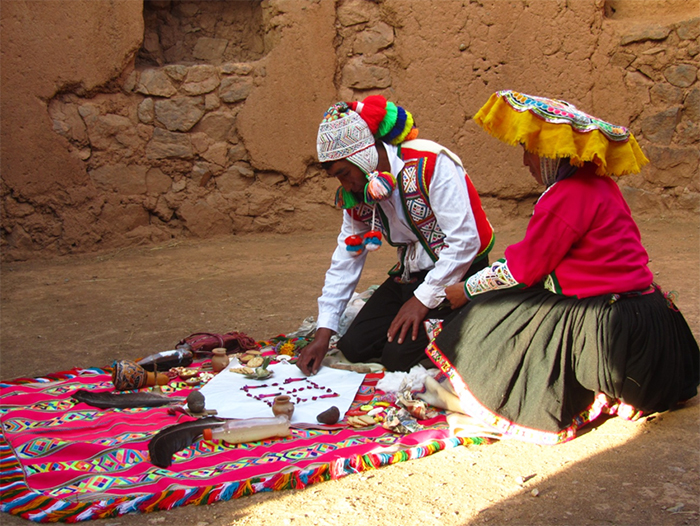 Carefully laying out the offering. Photo by Roger Valencia