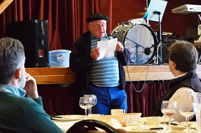 Johnny Curutchet sings a pre-written song with an assigned subject after lunch at the San Francisco Basque Cultural Center. Photo by Greyson Harris, Ralph Rinzler Folklife Archives