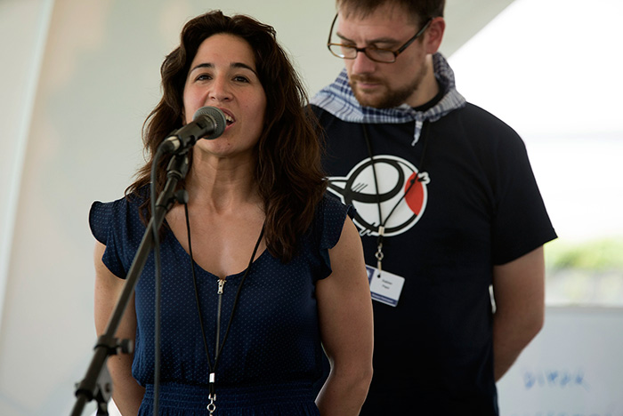 Irati Anda and Xabier Paya are bertsolariak, Basque poets who improvise songs on given topics. In today's "Berto Workshop," they sang about arriving in Washington, their favorite sports, and Xabi's amuma (grandmother). Photo by Maureen Spagnolo, Ralph Rinzler Folklife Archives