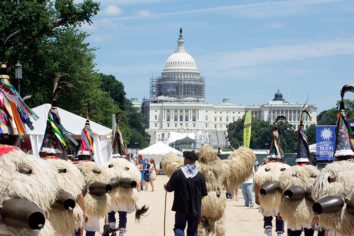 The Joaldunak practice a ritual procession in elaborate costumes: sheep skins, cone-shaped hats decorated with ribbons, and large—very loud—bells on their backs. Each afternoon through July 4, they will lead a parade around the National Mall. Photo by Ronald Villasante, Ralph Rinzler Folklife Archives