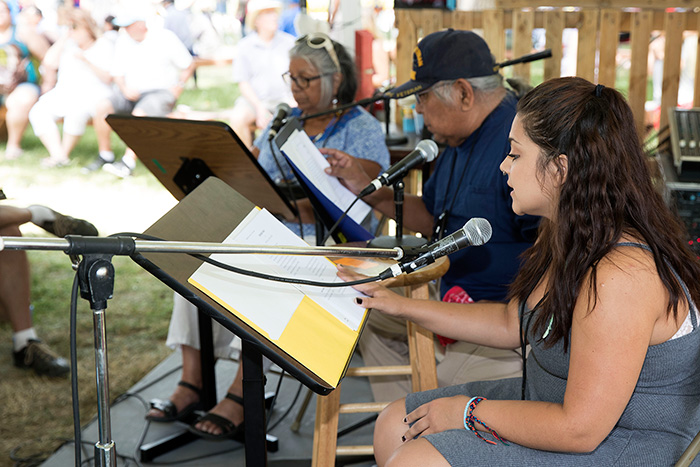 Helena and Preston Arrow-weed, accompanied by Maricella Rodriguez, present a radio drama that Preston is developing. Photo by Francisco Guerra, Ralph Rinzler Folklife Archives