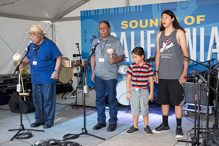 Preston Arrow-weed, Stan Rodriguez, Hwaa Hawk, and Raymond Martinez collaborate on sharing Native California song traditions. Photo by Francisco Guerra, Ralph Rinzler Folklife Archives