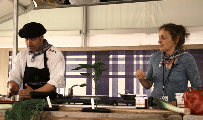 Chef Igor Ozamiz Goiriena demonstrates the traditional technique for creating pil-pil sauce while presenter Samiñe Irigoien translates. Ralph Rinzler Folklife Archives