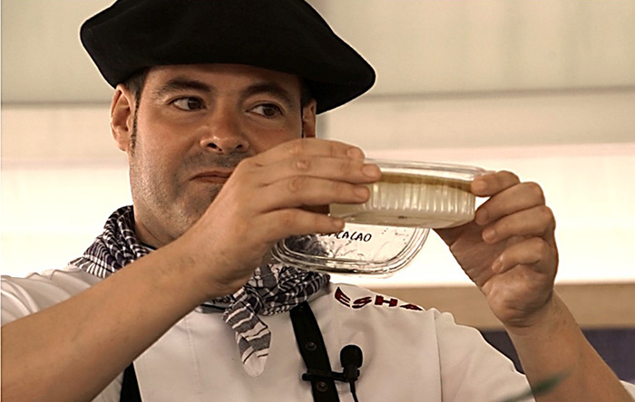 Igor Ozamiz Goiriena demonstrates the separated oil and gelatin. Ralph Rinzler Folklife Archives