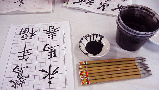 Practicing calligraphy. Photo by Betty Belanus